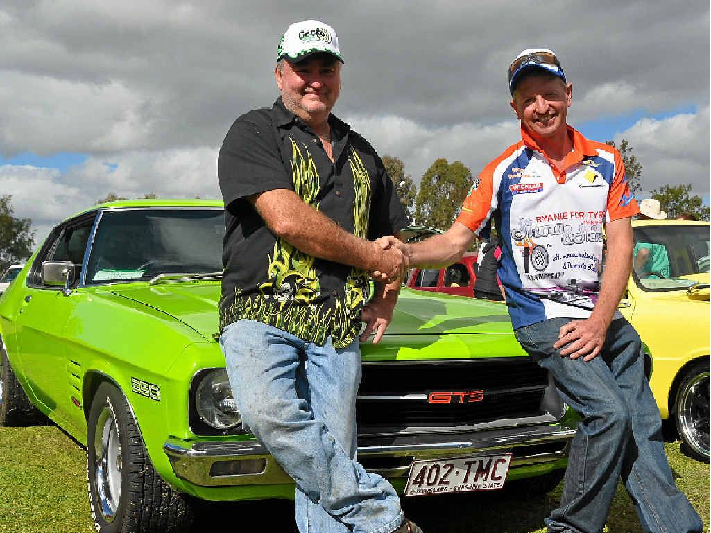 THE PEOPLE HAVE SPOKEN: Brendan Ryan from Ryanie for Tyres congratulates Phil Farrell on being awarded People’s Choice Car with his 1971 HQ Holden Monaro GTS at the Ryanie for Tyres Show and Shine on Saturday.